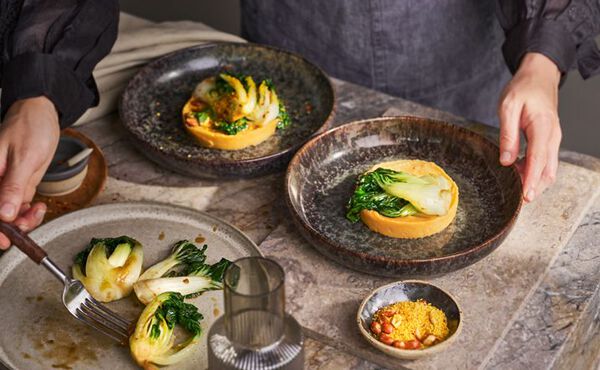 Asian-inspired vegetarian stamppot topped with bok choi, ready to serve.